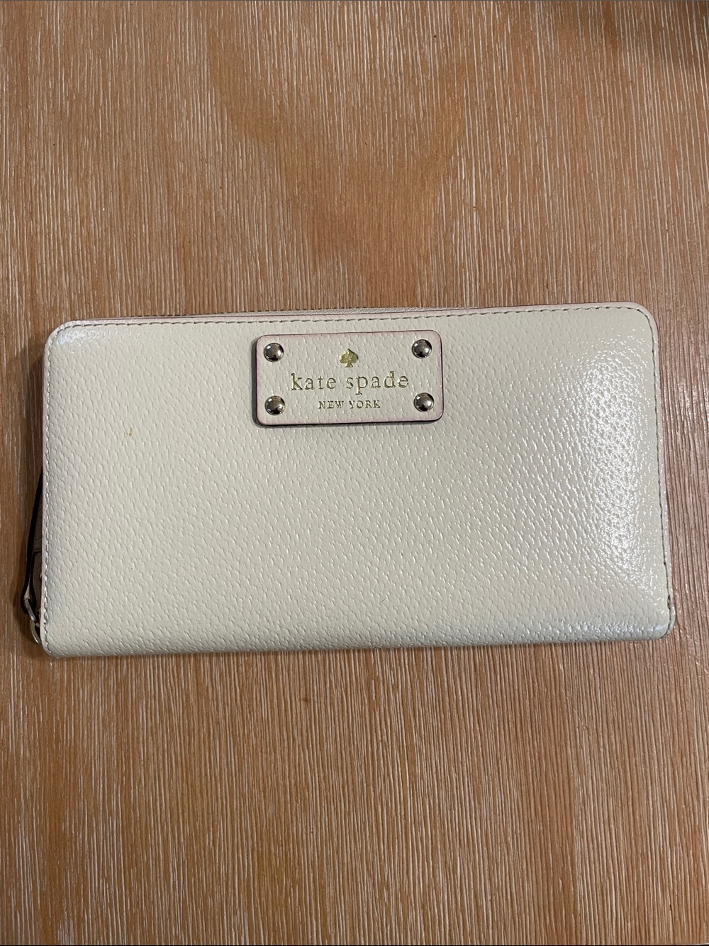 kate spade cream zip-around wallet with logo plaque